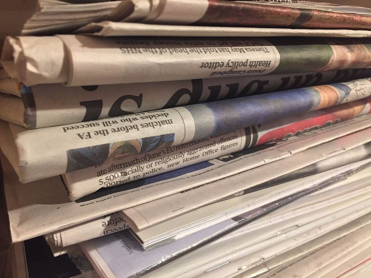 Close-up of a stack of folded printed newspapers